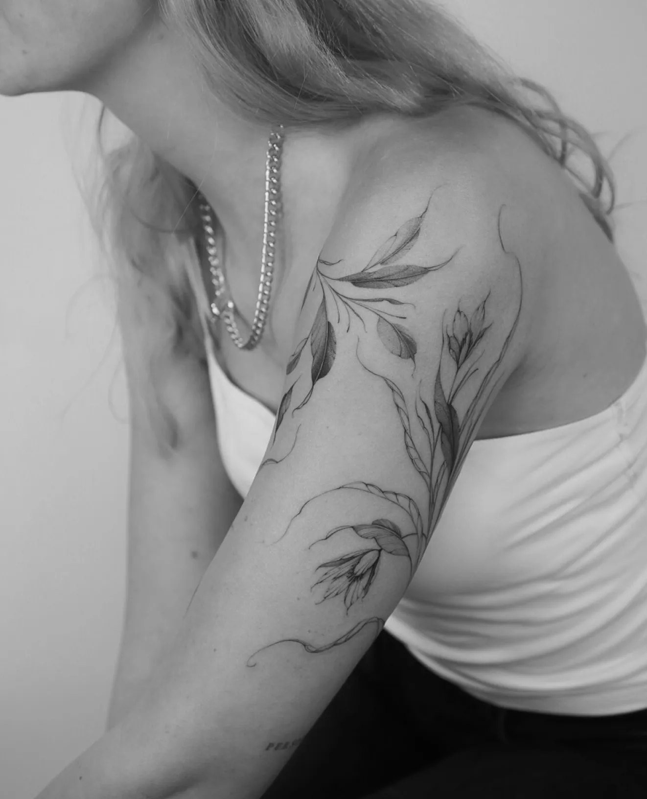 Botanic tattoo on arm made by tattoo artist Nilou 