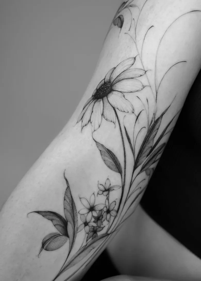 Botanical tattoo on arm made by tattoo artist from Hamburg Nilou