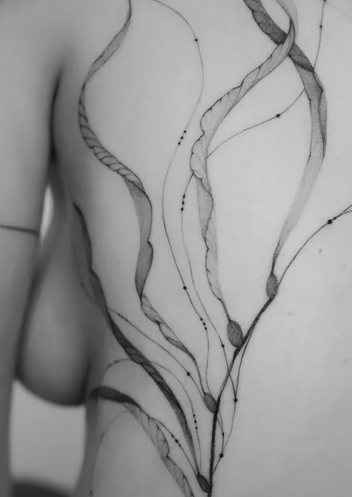 Floral tattoo with Japanese motives made by tattoo artist Nilou from Hamburg